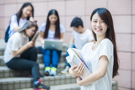group of happy college students outdoorsの写真素材