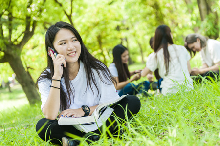 group of happy college students outdoorsの写真素材