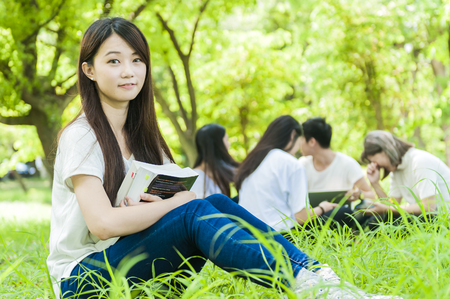 group of happy college students outdoorsの写真素材