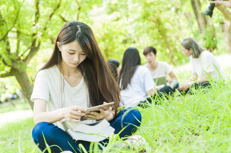 group of happy college students outdoorsの写真素材
