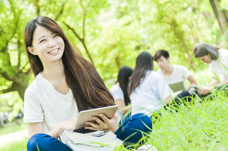 group of happy college students outdoorsの写真素材