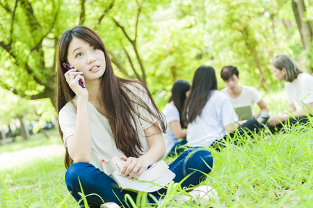 group of happy college students outdoorsの写真素材