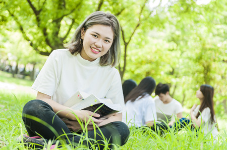 group of happy college students outdoorsの写真素材