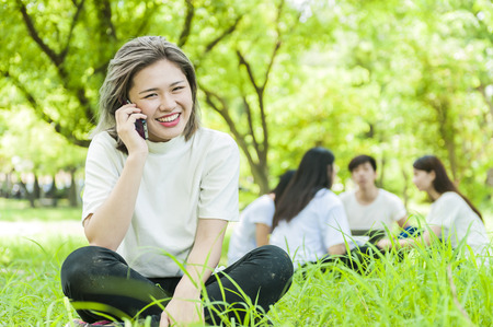 group of happy college students outdoorsの写真素材