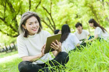 group of happy college students outdoorsの写真素材