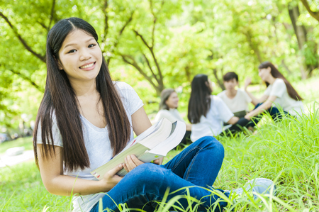 group of happy college students outdoorsの写真素材