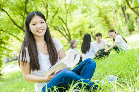 group of happy college students outdoorsの写真素材