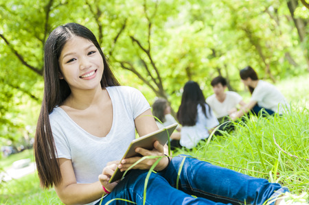 group of happy college students outdoorsの写真素材