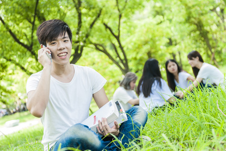 group of happy college students outdoorsの写真素材