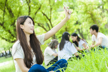 group of happy college students outdoorsの写真素材