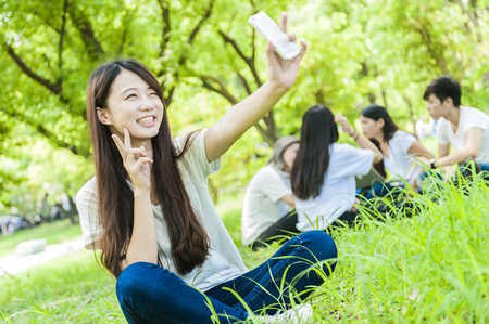 group of happy college students outdoorsの写真素材