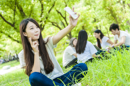group of happy college students outdoorsの写真素材
