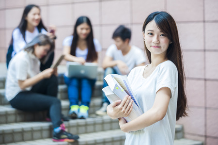group of happy college students outdoorsの写真素材