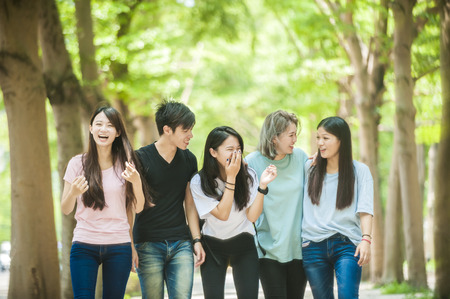 group of happy college students outdoorsの写真素材