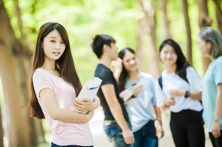 group of happy college students outdoorsの写真素材