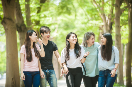 group of happy college students outdoorsの写真素材