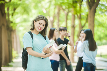 group of happy college students outdoorsの写真素材