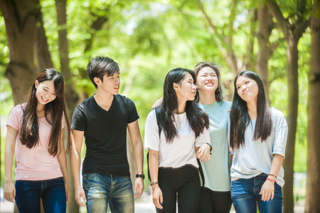 group of happy college students outdoorsの写真素材