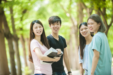 group of happy college students outdoorsの写真素材
