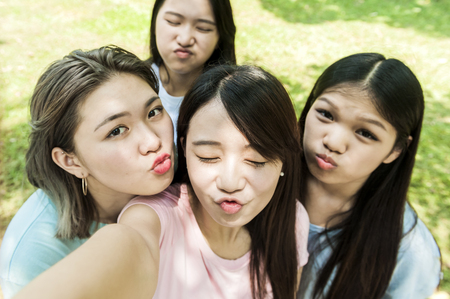 group of happy college students outdoorsの写真素材