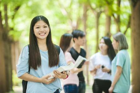 group of happy college students outdoorsの写真素材