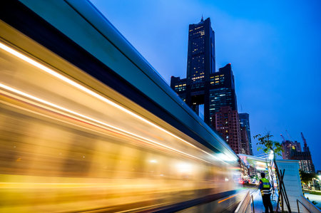 Kaohsiung, Taiwan - November 25 : View of light rail tram and the skyline in Kaohsiung, Taiwan on...
