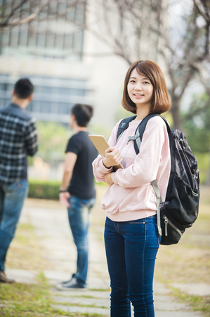 woman using a tablet pc at outdoorの写真素材