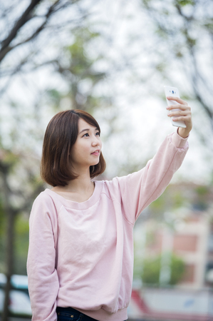 woman use of smartphone at outdoorの写真素材