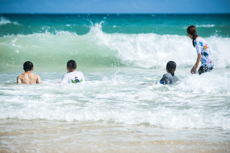KENTING,TAIWAN - people at white sand beachの写真素材