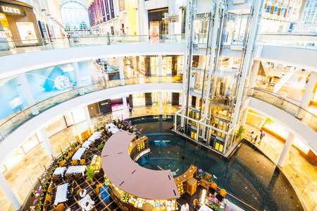 SINGAPORE - August 23: Timelapse in motion - inside view in the shopping mall "The Shoppe" at Marina Bay Sands on August 23, 2017 in Singapore.のeditorial素材