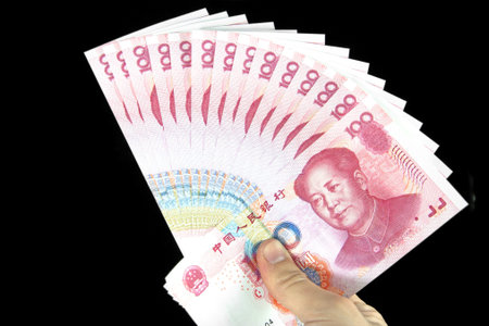 Chinese currency and handの写真素材