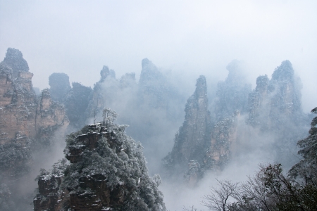 zhangjiajie national park in winter with snow and fog,Hunan Chinaの写真素材
