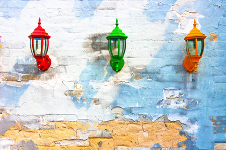 Old street lamp on a  wall backgroundの写真素材