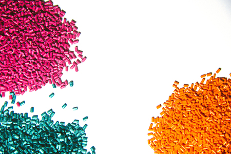Plastic granules close up for holding,Colorful plastic granules with white background. and dollar money,Plastic Business.の写真素材