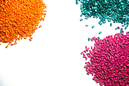Plastic granules close up for holding,Colorful plastic granules with white background. and dollar money,Plastic Business.の写真素材