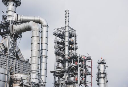 Industrial zone,The equipment of oil refining,Close-up of industrial pipelines of an oil-refinery plant,Detail of oil pipeline with valves in large oil refineryの写真素材