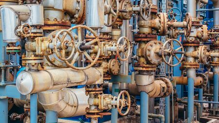Industrial zone,The equipment of oil refining,Close-up of industrial pipelines of an oil-refinery plant,Detail of oil pipeline with valves in large oil refinery.の写真素材