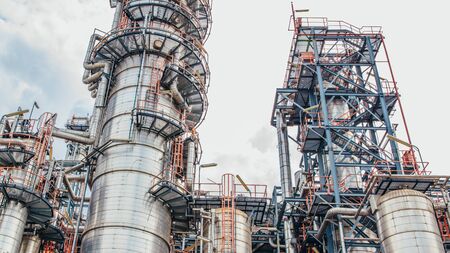 Industrial zone,The equipment of oil refining,Close-up of industrial pipelines of an oil-refinery plant,Detail of oil pipeline with valves in large oil refinery.の写真素材