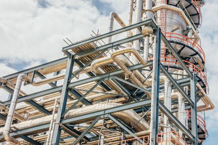Industrial zone,The equipment of oil refining,Close-up of industrial pipelines of an oil-refinery plant,Detail of oil pipeline with valves in large oil refinery.の写真素材
