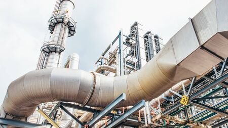 Industrial zone,The equipment of oil refining,Close-up of industrial pipelines of an oil-refinery plant,Detail of oil pipeline with valves in large oil refinery.の写真素材