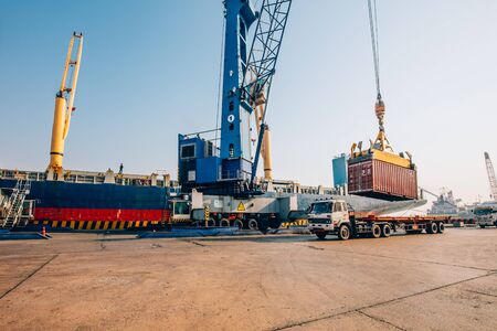 Business Logistics concept,Truck in container depot in import and export area at port,Container Cargo freight ship for Logistic Import Exportのeditorial素材