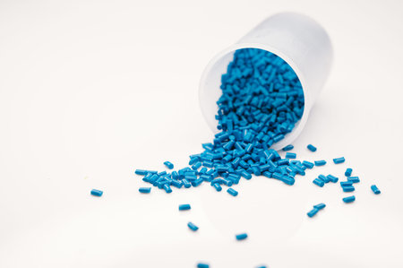 Plastic granules close up for holding,Colorful plastic granules with white background. and dollar...