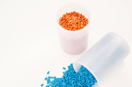 Plastic granules close up for holding,Colorful plastic granules with white background. and dollar money,Plastic Business,Plastic industry.の写真素材