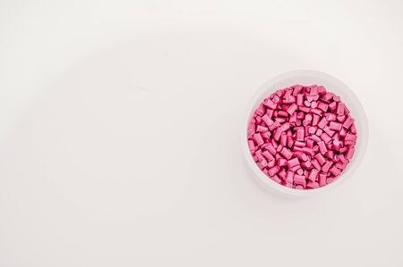 Plastic granules close up for holding,Colorful plastic granules with white background. and dollar money,Plastic Business,Plastic industry.の写真素材