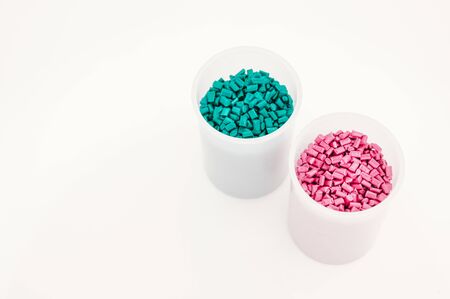 Plastic granules close up for holding,Colorful plastic granules with white background. and dollar money,Plastic Business,Plastic industry.の写真素材