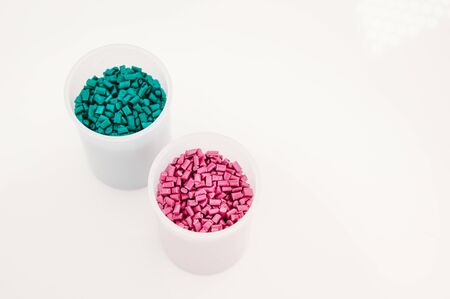 Plastic granules close up for holding,Colorful plastic granules with white background. and dollar money,Plastic Business,Plastic industry.の写真素材
