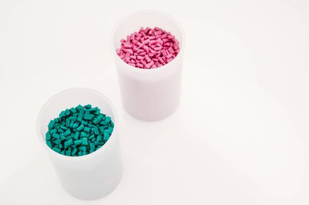 Plastic granules close up for holding,Colorful plastic granules with white background. and dollar money,Plastic Business,Plastic industry.の写真素材