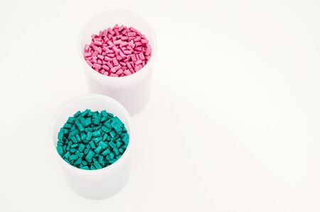 Plastic granules close up for holding,Colorful plastic granules with white background. and dollar money,Plastic Business,Plastic industry.の写真素材