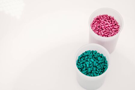 Plastic granules close up for holding,Colorful plastic granules with white background. and dollar money,Plastic Business,Plastic industry.の写真素材