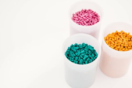 Plastic granules close up for holding,Colorful plastic granules with white background. and dollar money,Plastic Business,Plastic industry.の写真素材